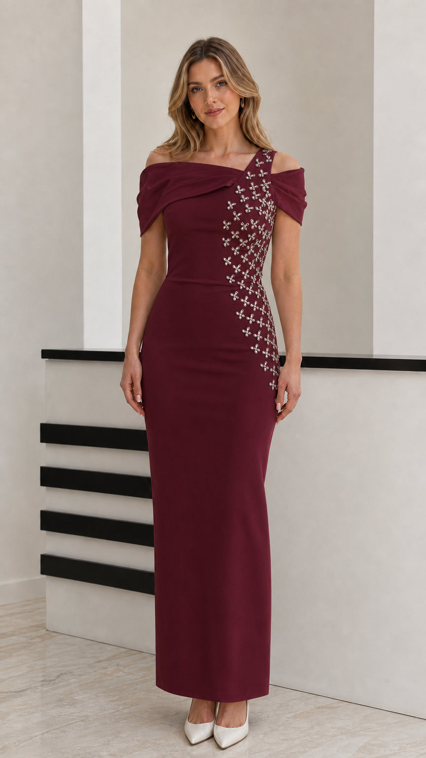 Front view of model wearing burgundy wine red off-shoulder embellished formal gown