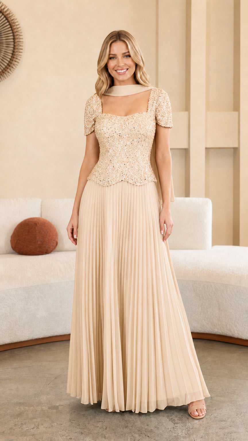 Model wearing Champagne beige sequined bodice pleated maxi formal gown