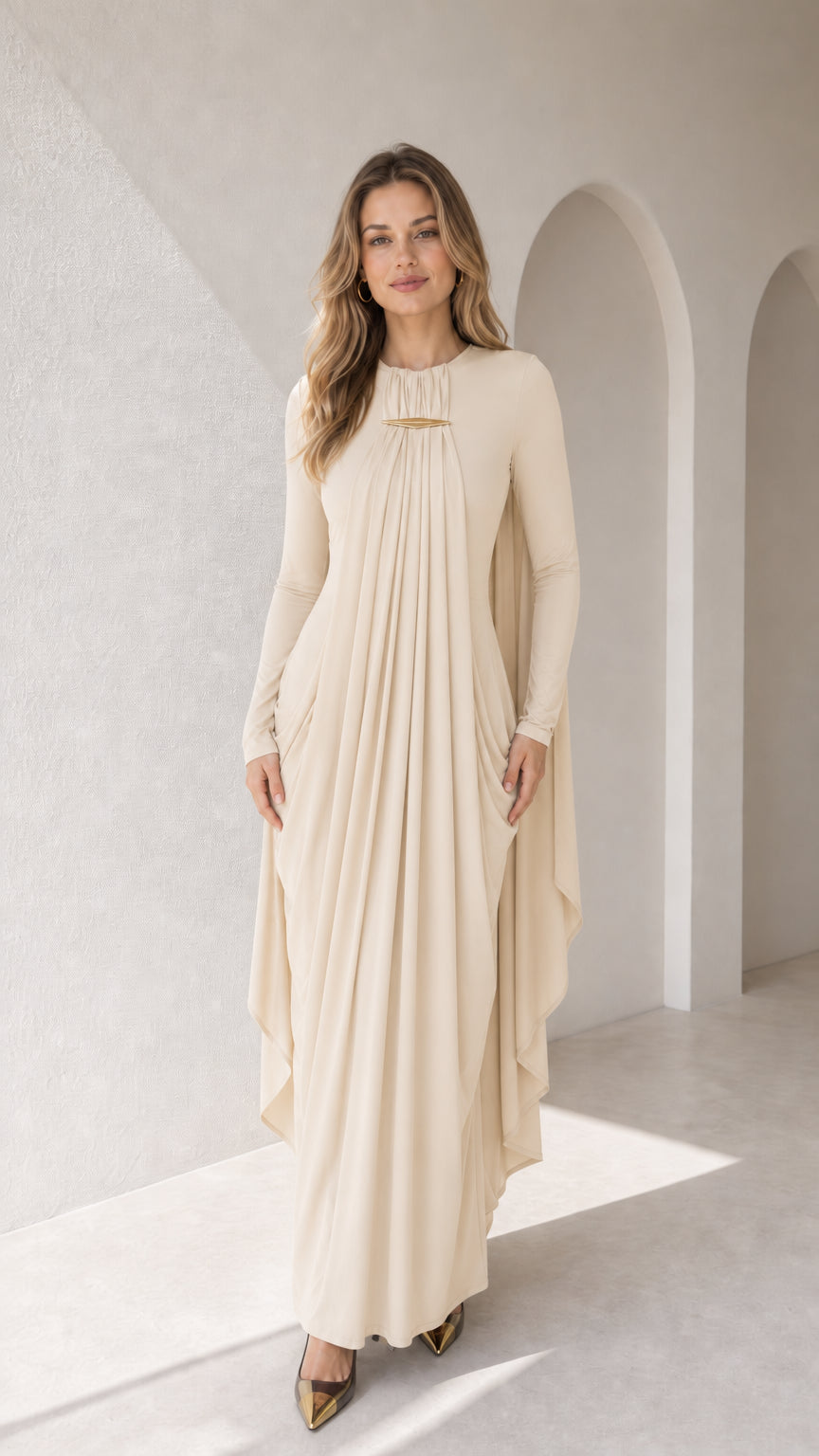 Full-length front view of cream long sleeve pleated cape drape maxi dress