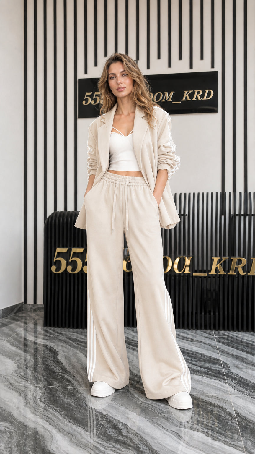 Full front view of women's beige 2-piece blazer and track pant set