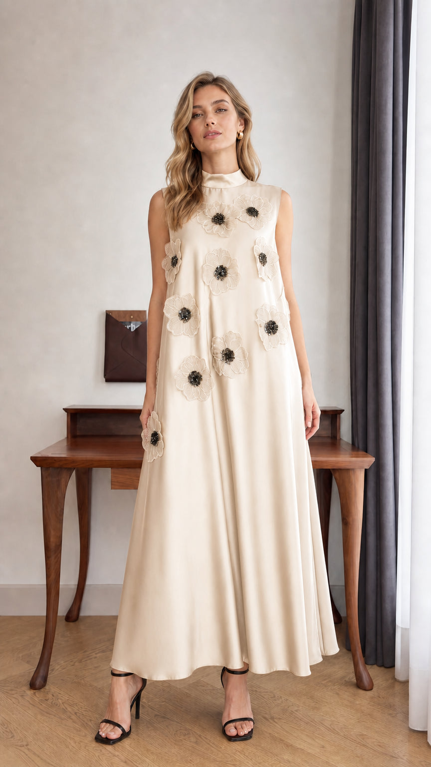 Model wearing Champagne sleeveless 3D floral applique high neck maxi dress