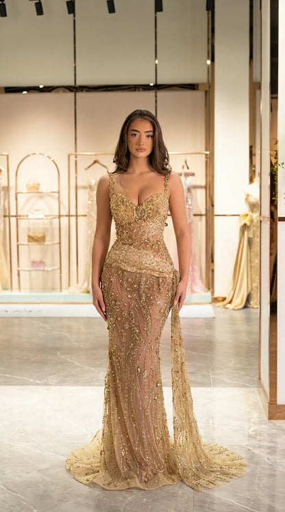 Full front view of gold beaded sweetheart mermaid evening gown with side train