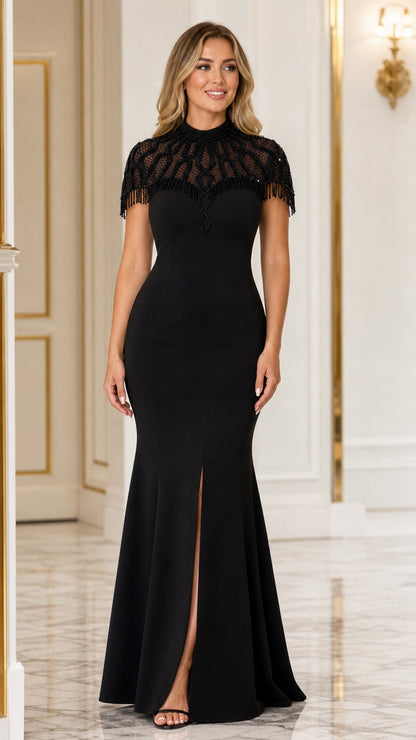 Model wearing black beaded mock neck mermaid evening gown with front slit front view