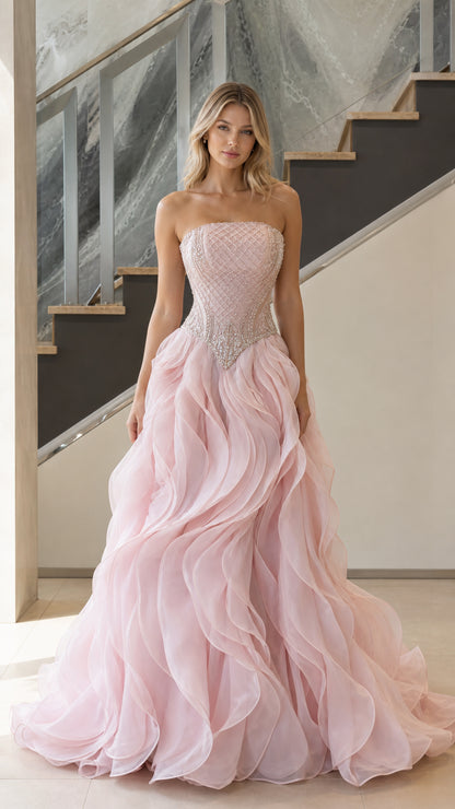 Full front view of blush pink strapless beaded corset ball gown with ruffle skirt