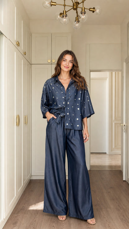 Model wearing Denim Blue polka dot button-down shirt and wide-leg trousers two-piece set front view