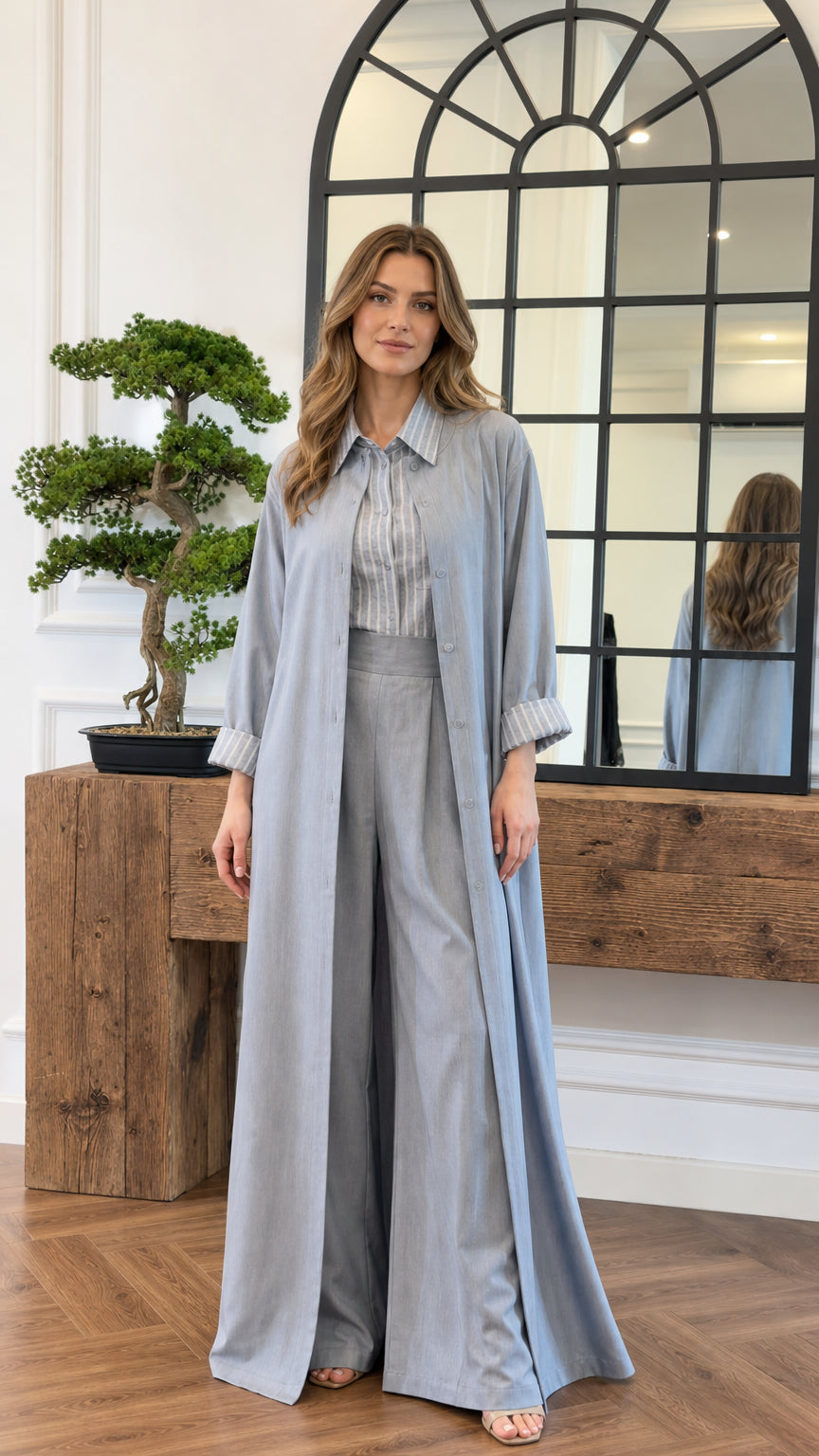 Front view of model wearing the light blue 3-piece modest duster and pant set with striped shirt