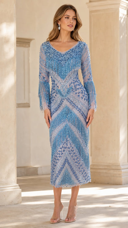 Front full view of woman wearing Light Blue beaded fringe long sleeve midi evening dress