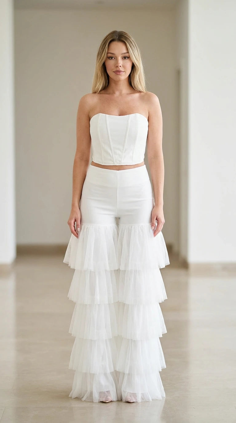 White strapless corset top and tiered tulle flare pants two-piece set front view