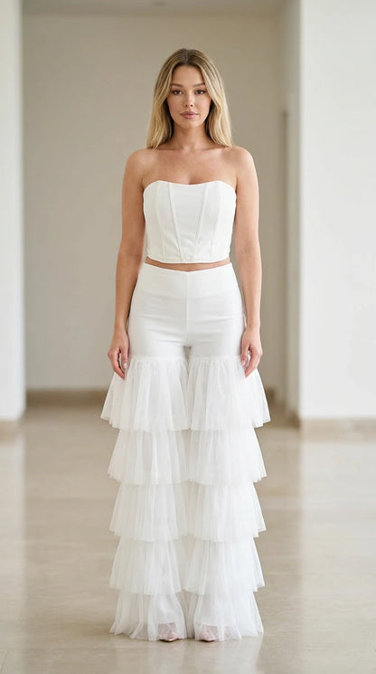 White strapless corset top and tiered tulle flare pants two-piece set front view