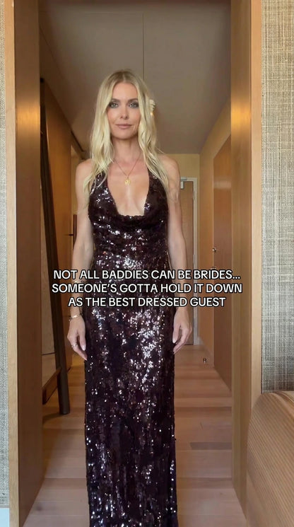 Front view of model wearing burgundy sequin cowl halter maxi evening gown