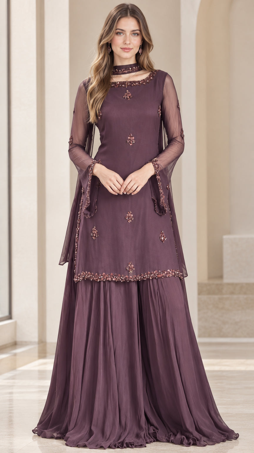 Front view of model wearing plum embroidered tunic and flared pleated sharara pants
