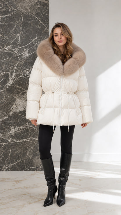 Front view of model wearing off-white quilted puffer coat with plush fur collar and knee-high boots