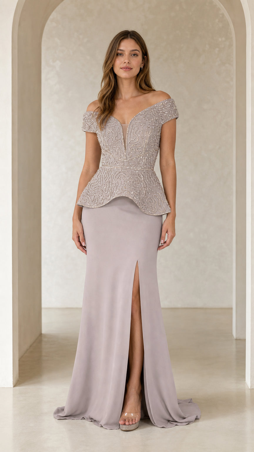Front view of model wearing dusty lilac off-the-shoulder beaded peplum evening gown with front slit