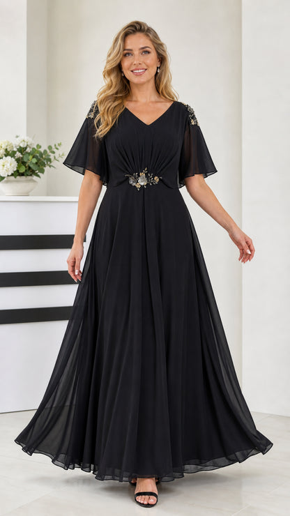 Front view of black flutter sleeve chiffon maxi evening dress with beaded waist detail