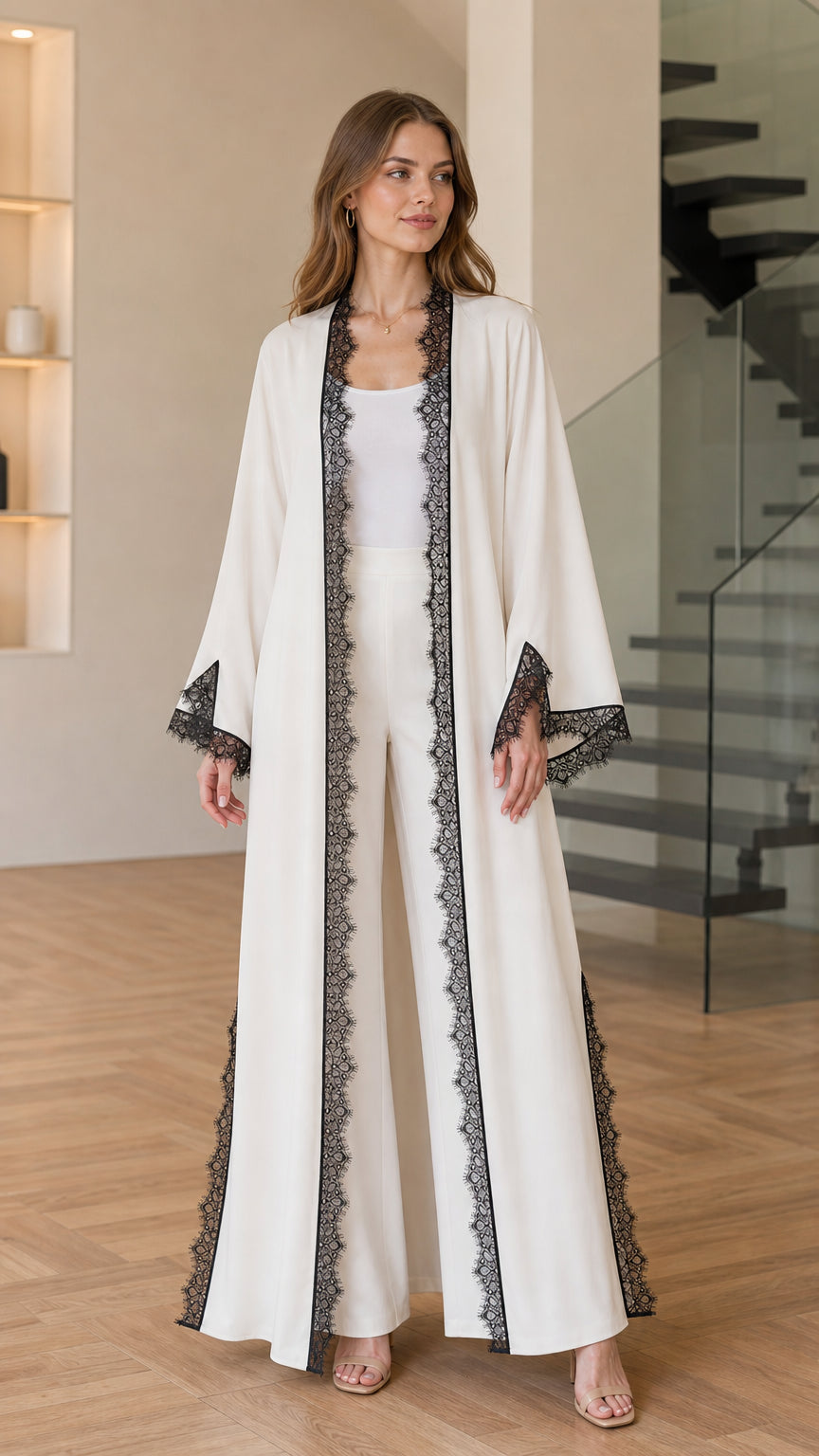 Front full-length view of woman wearing off-white lace trim open-front maxi kimono cardigan