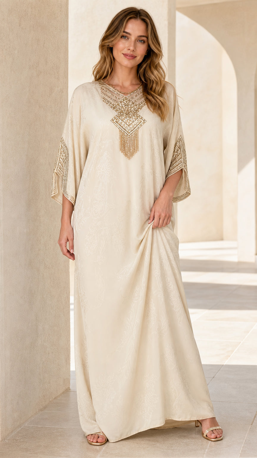 Model wearing Cream embellished kaftan maxi dress with beaded neckline front view