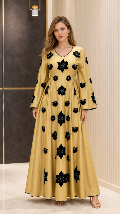 Front view of Mustard Gold satin maxi dress with black floral appliques