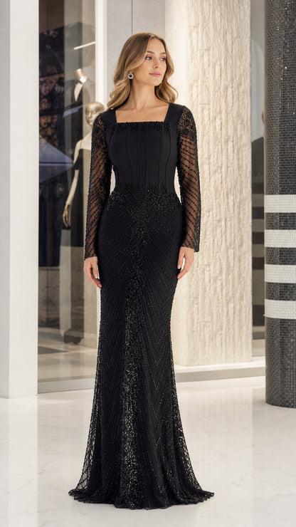 Front view of black square neck beaded mermaid evening gown with long sleeves