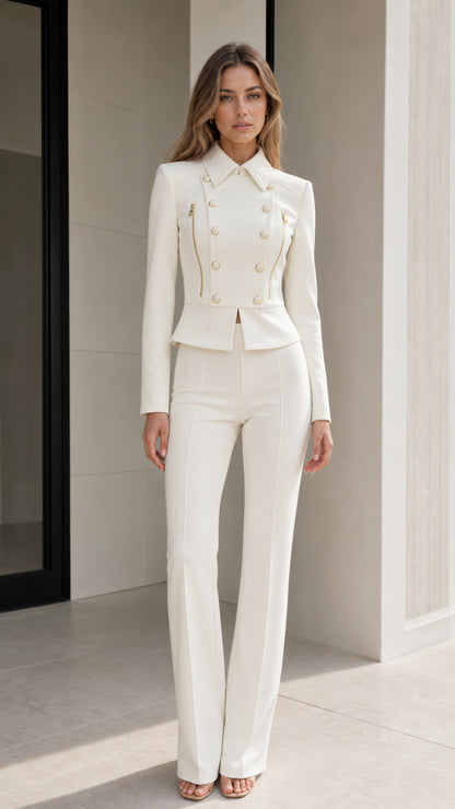 Front view of model wearing white double-breasted peplum blazer and matching flared pants