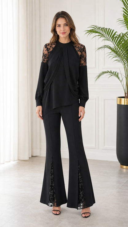 Front full-length view of model wearing black long sleeve lace patchwork top and matching flare pants set
