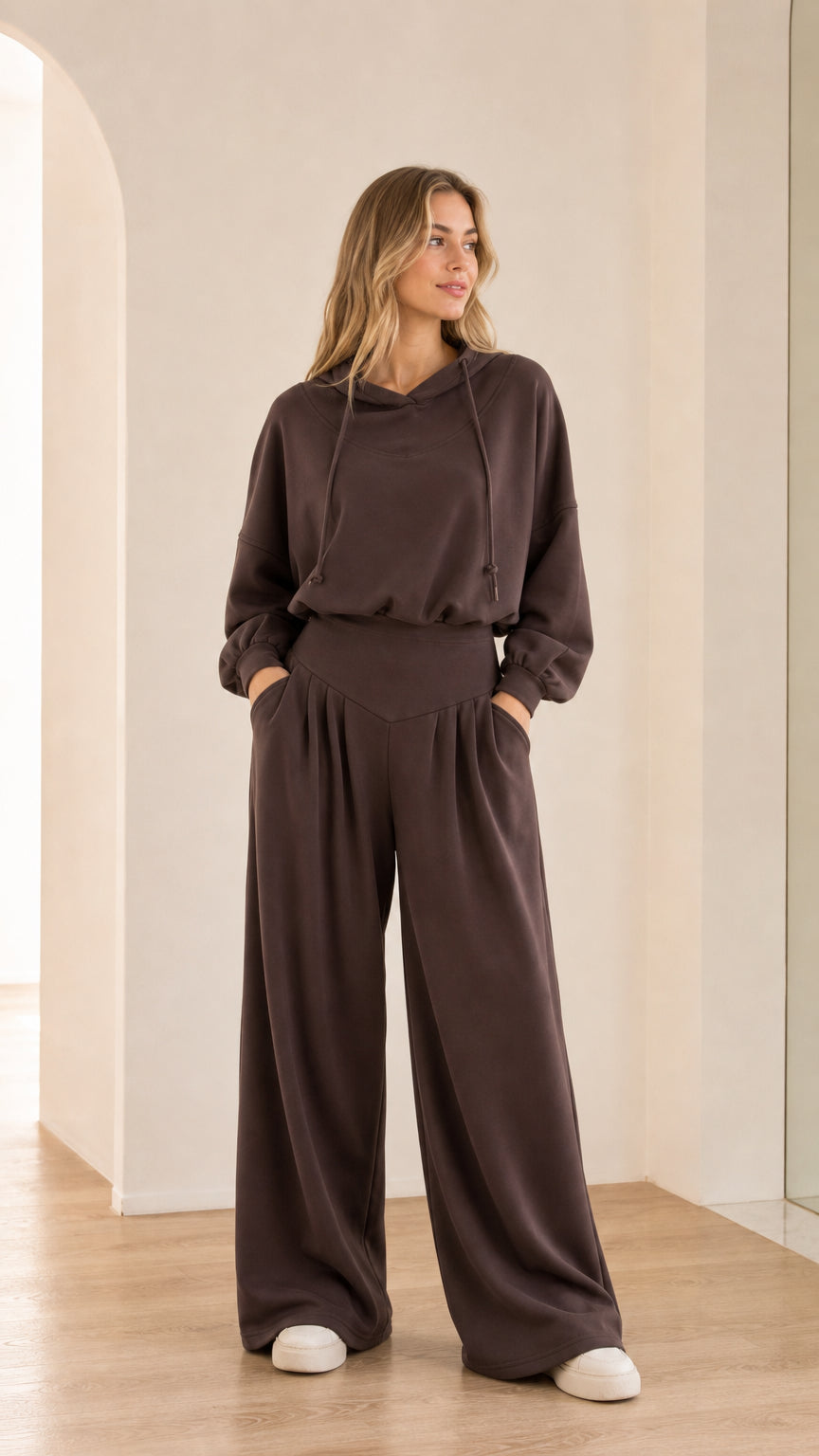 Front view of model wearing chocolate brown 2-piece hooded wide-leg lounge set