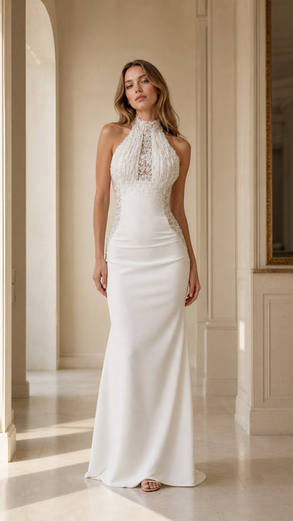Front full view of woman wearing white halter beaded fringe lace mermaid maxi evening gown