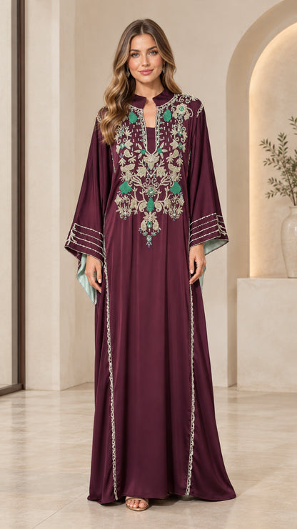 Front full-length view of woman wearing burgundy embroidered maxi kaftan dress