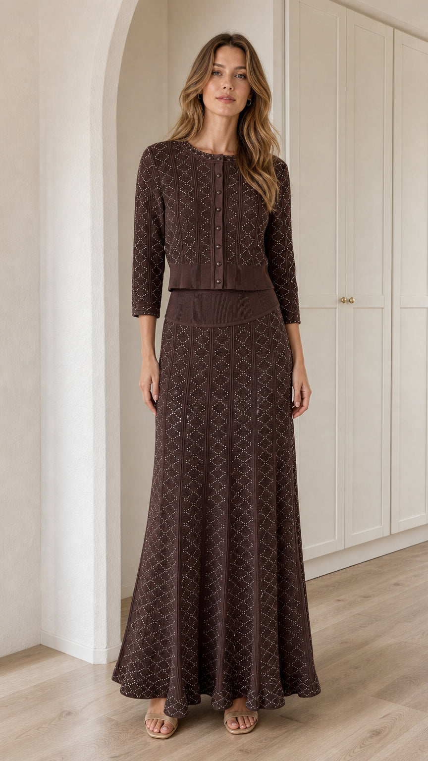 Front view of model wearing Chocolate Brown pointelle knit cardigan and maxi skirt set