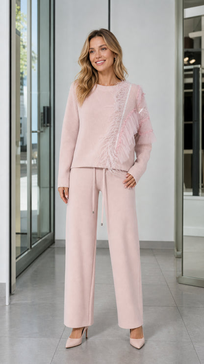 Front view of woman wearing Light Pink feather trim knit sweater and matching wide-leg pants set