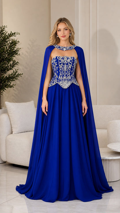 Front view of royal blue embellished corset evening gown with attached cape