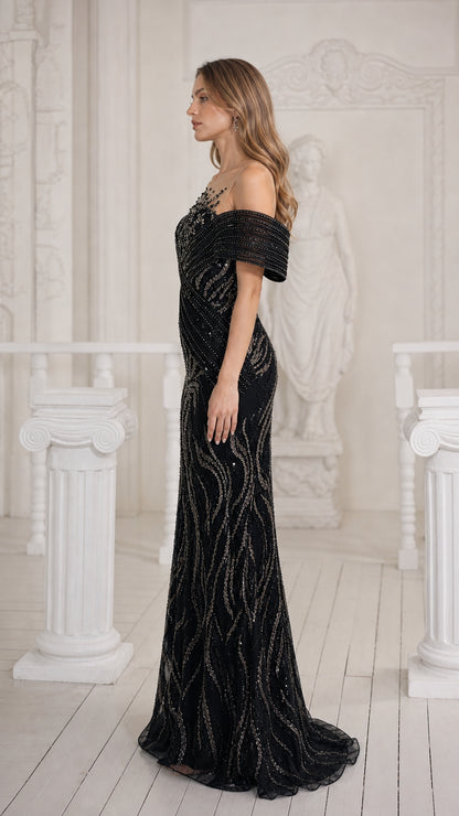 Side profile of black sequined floor-length formal dress showing tailored fit