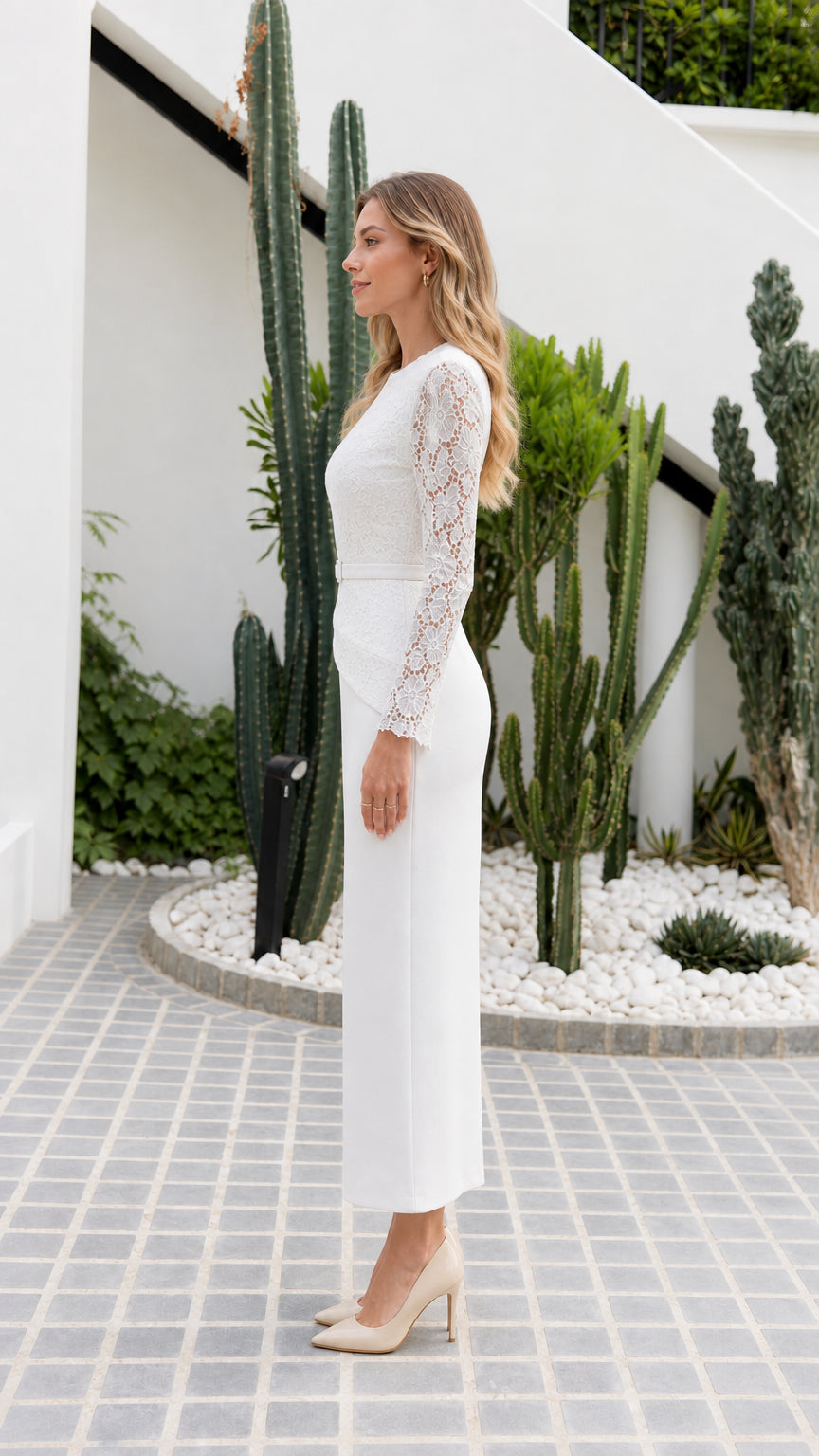 Side profile of model wearing white lace long sleeve column dress
