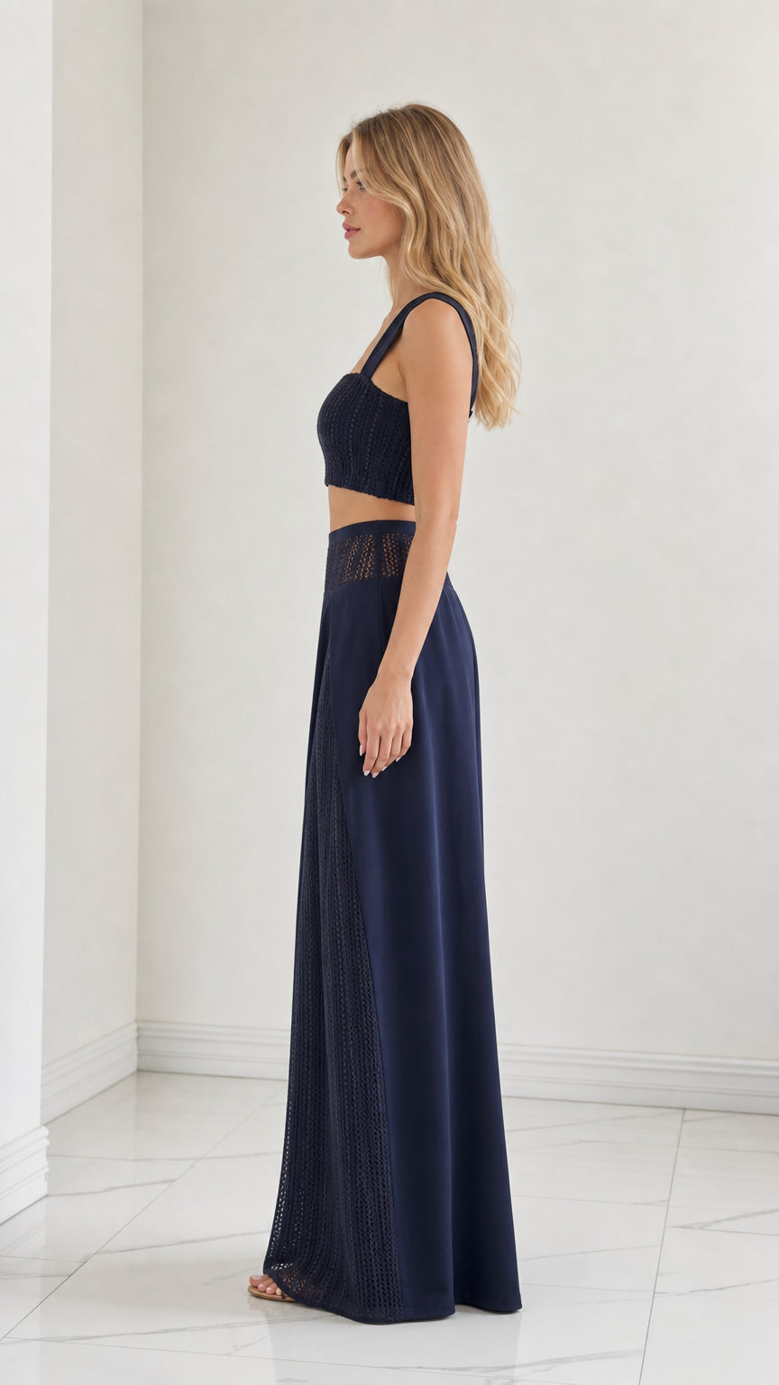 Side profile of model in Navy Blue two-piece matching set with wide-leg trousers