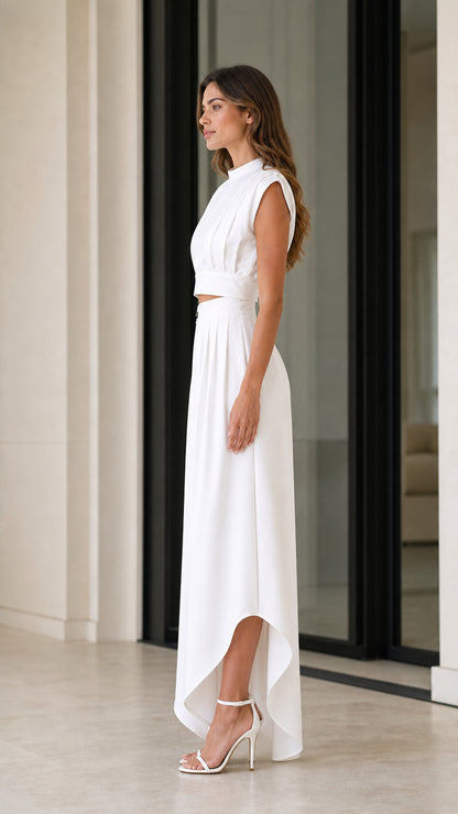 Side profile of model wearing white two-piece crop top and wide-leg trousers set