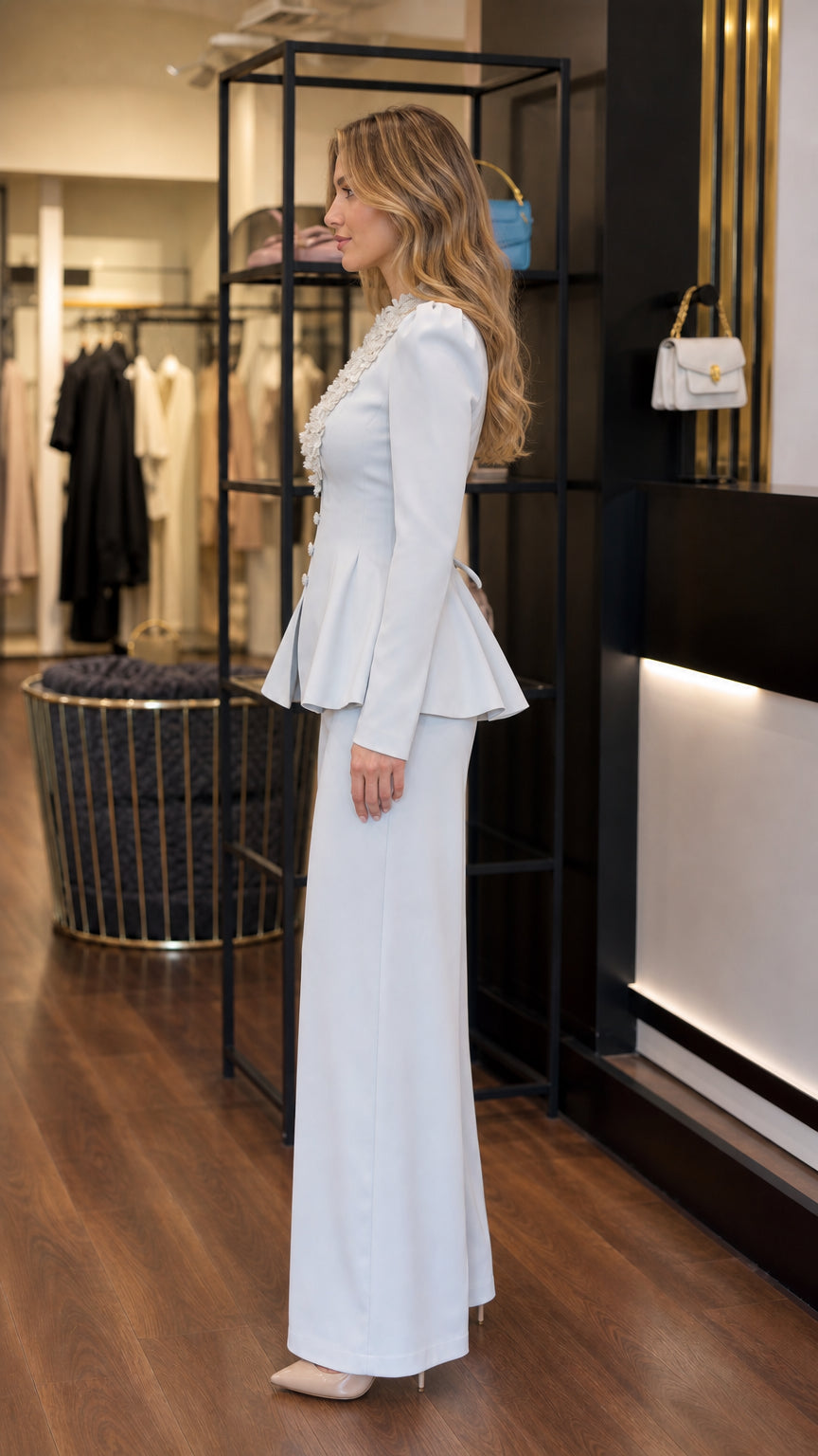 Side view of light blue tailored peplum blazer and wide leg trousers