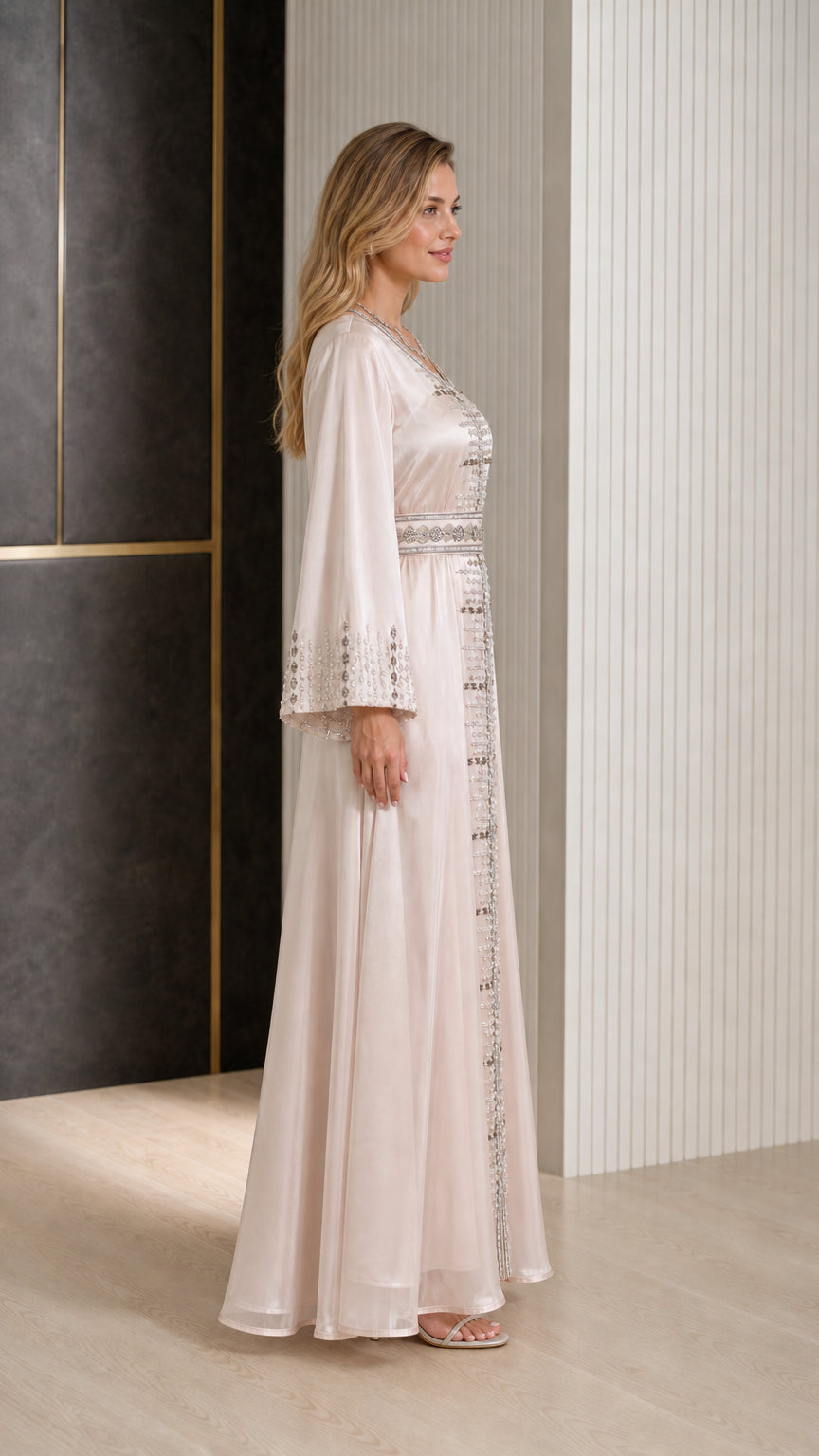 Side profile of woman wearing Champagne satin embroidered long gown