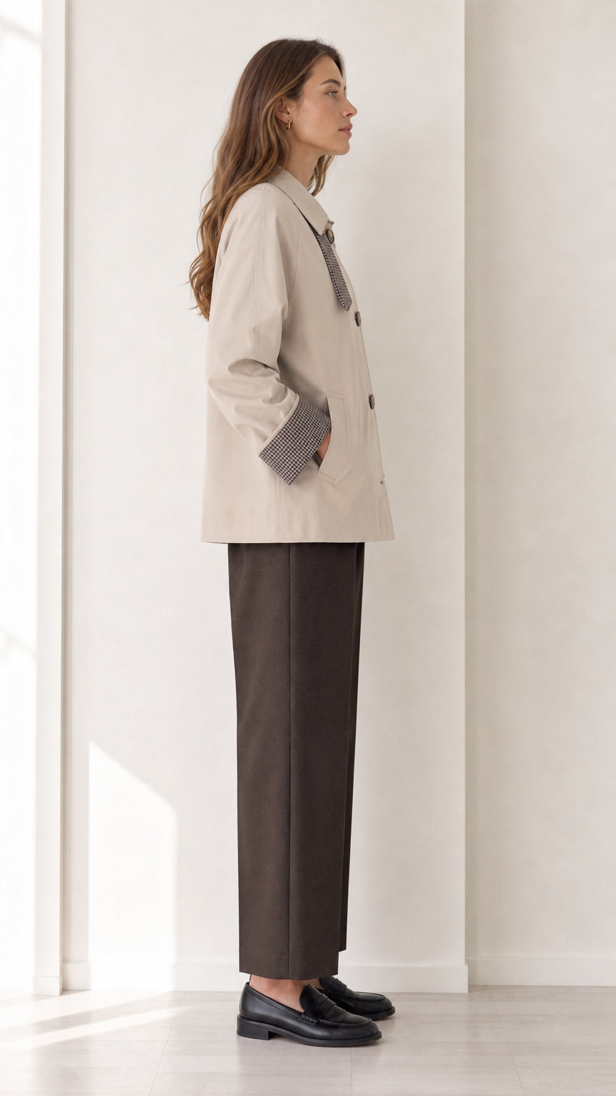Side profile of women's beige short button-front jacket with plaid cuff accent