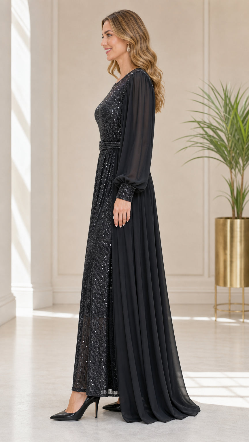Side profile view of black sequin and chiffon formal gown