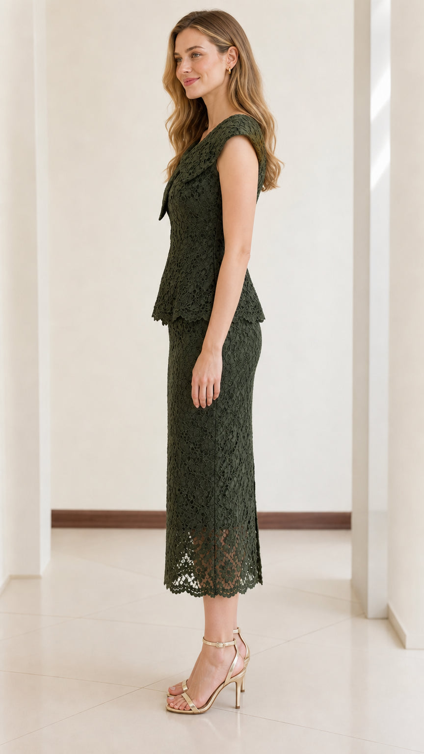 Side profile view of dark green floral lace peplum midi dress