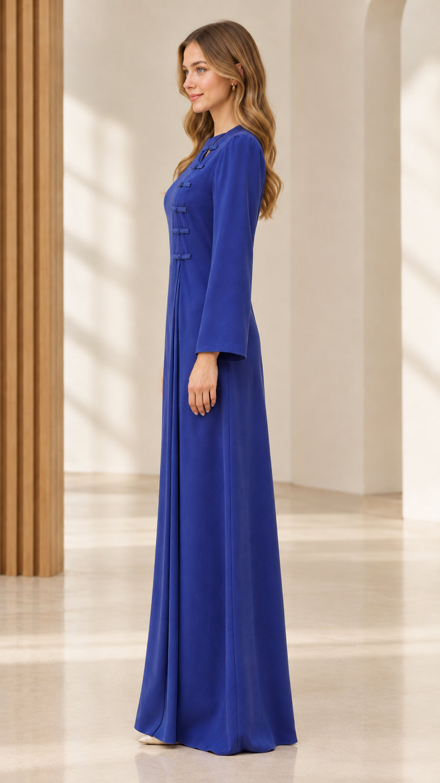 Side profile of royal blue pleated long sleeve formal maxi dress
