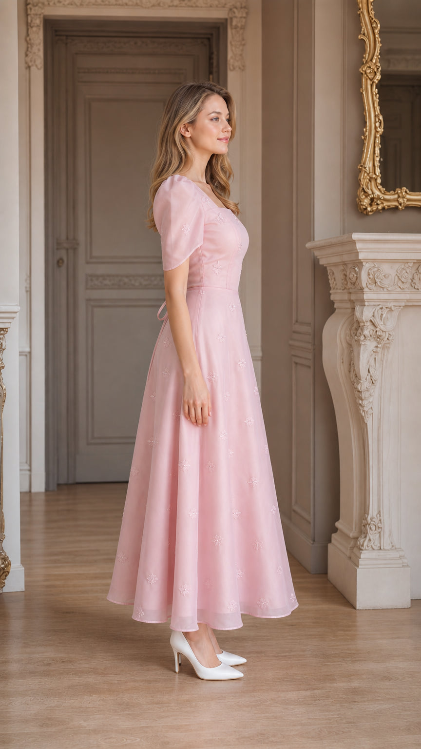 Side profile view of blush pink puff sleeve A-line midi dress