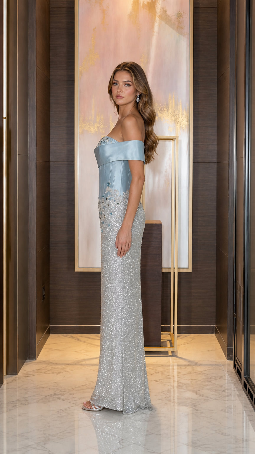 Side profile of model in Ice Blue embellished corset formal gown