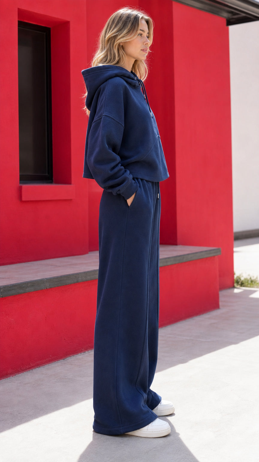 Side profile view of woman modeling navy blue matching loungewear set