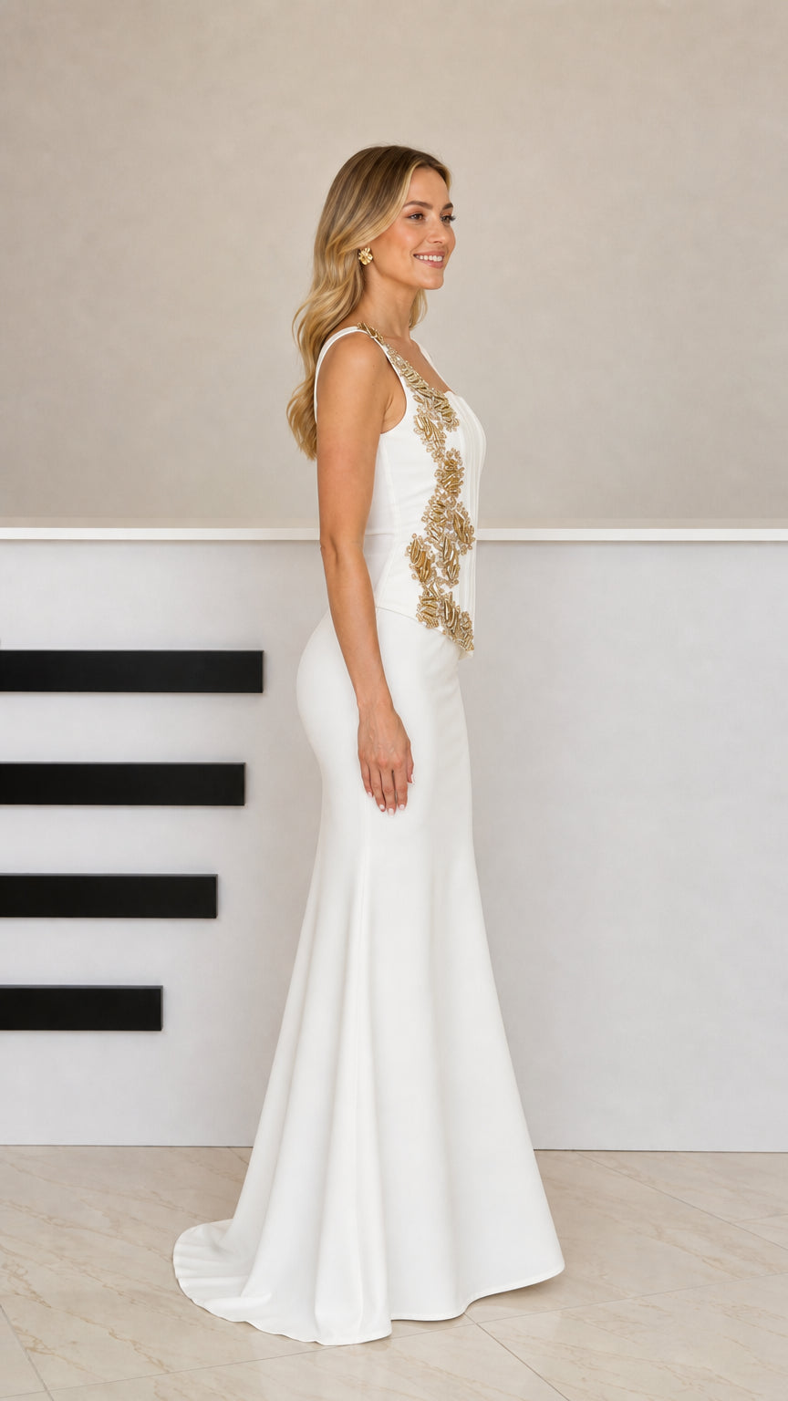 Side profile of model in white embellished square neck formal gown