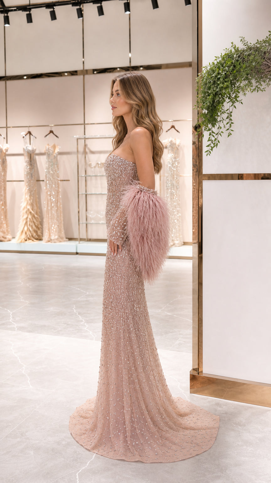 Side view of Blush Pink embellished mermaid gown showing fitted silhouette and train