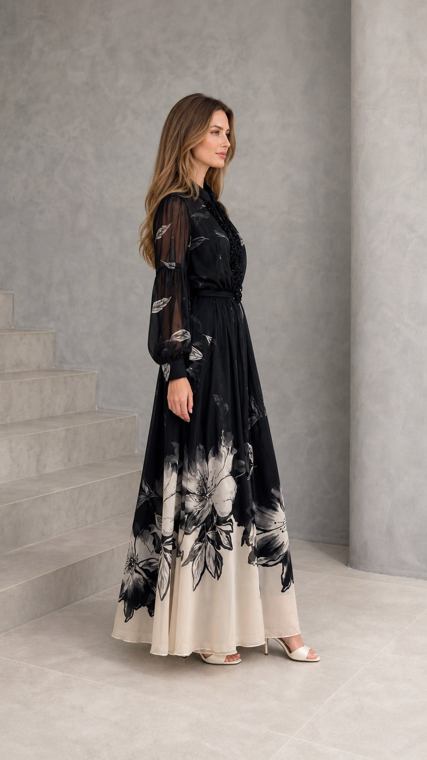 Side profile of woman wearing black floral chiffon evening gown