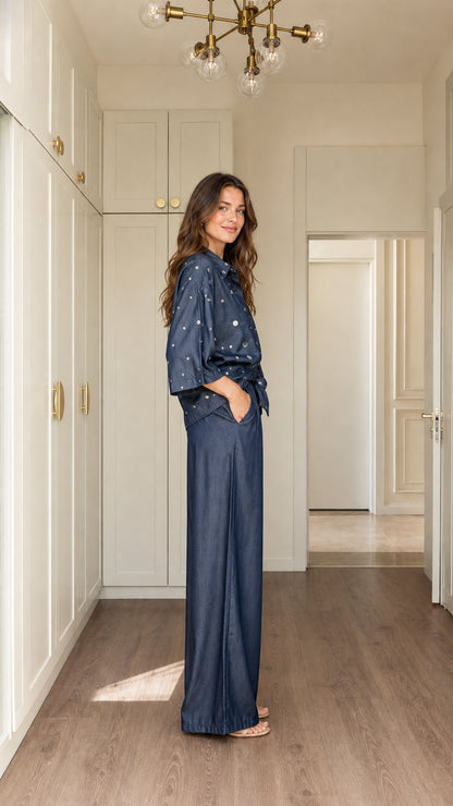 Model wearing Denim Blue two-piece co-ord set side profile view