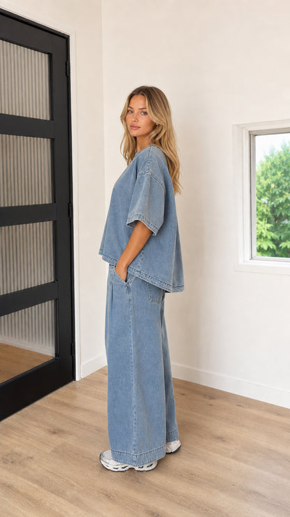 Side profile view of model wearing Washed Blue relaxed two-piece lounge set
