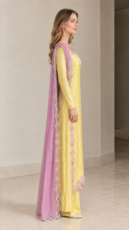 Side angle view of model in Yellow long tunic and wide leg trousers
