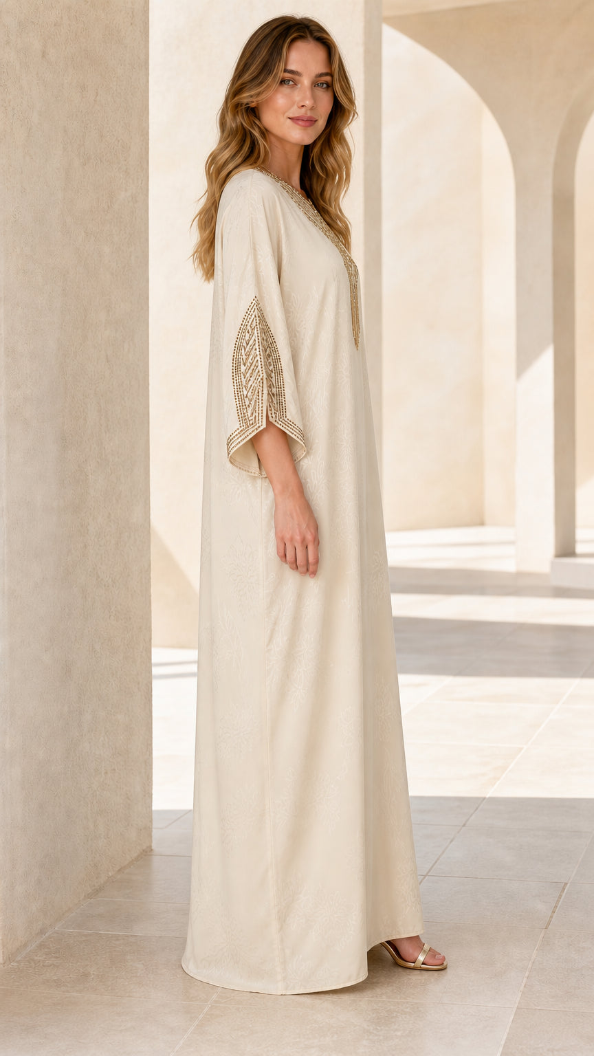 Side profile of model wearing Cream flowing kaftan dress